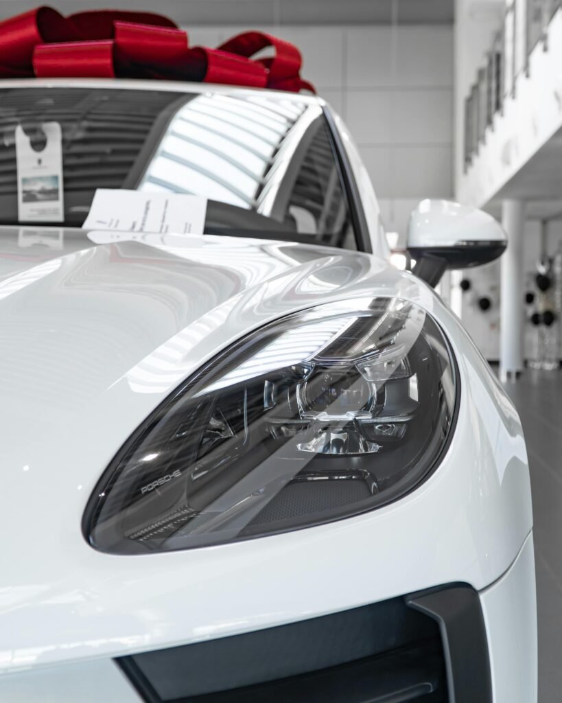 pexels-photo-12187077-12187077 A sleek and modern white car with a red bow. Ceramic coating in ocean view nj